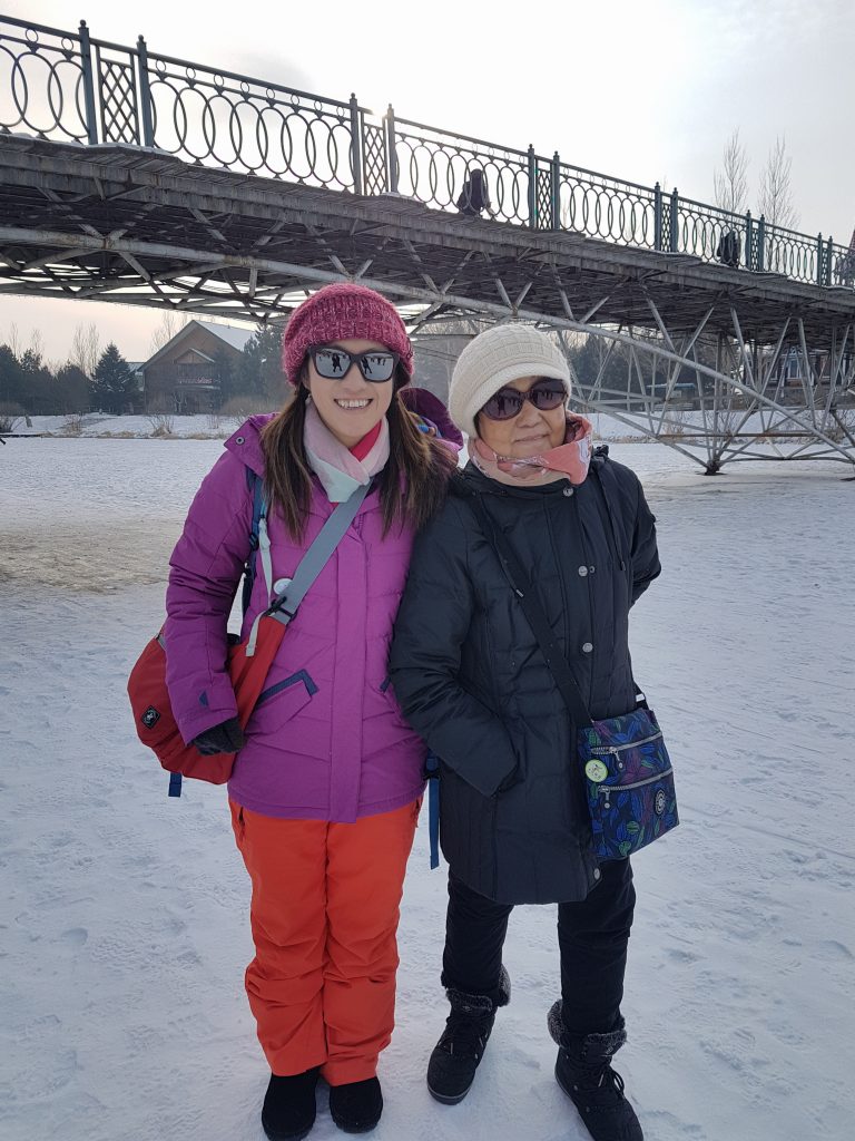 Walking on the frozen river running through Volga Manor, Harbin, China